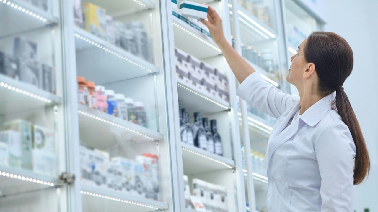 pharmaceutist-reaching-for-medications-on-pharmacy-shelves-e1714490013221.jpg